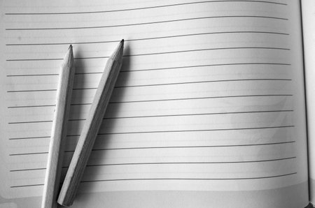 Black and white image of note paper and pencilsの写真素材