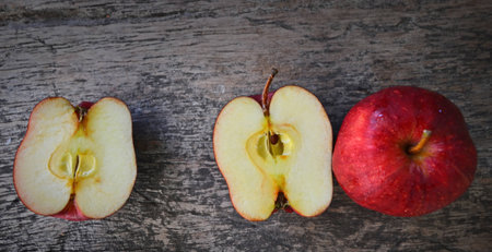 Top view of red apples on old wooden floorの写真素材