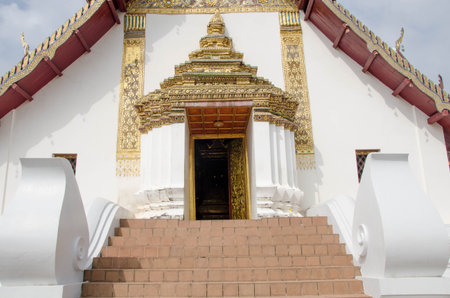 Tile stairs to beautiful arch of white templeの写真素材