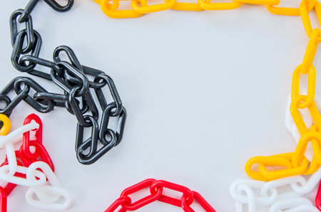 Colored plastic chain border on white board