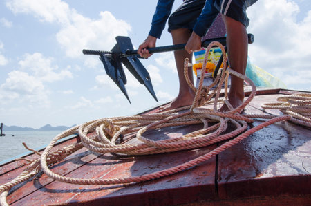 Working man and anchor and rope