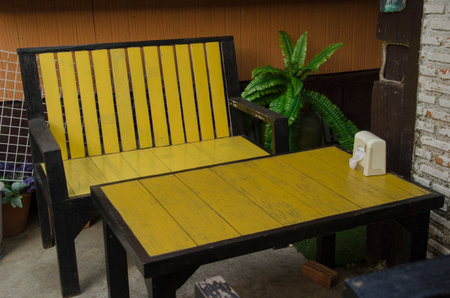 Yellow chair and table on the floor