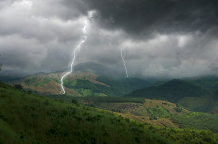 Scary lightnings and clouds over mountains in monsoon season