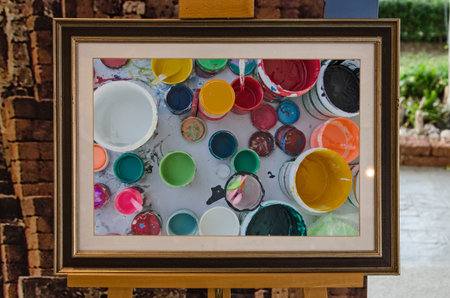 Pots and bucket of colors in the frame on the stand