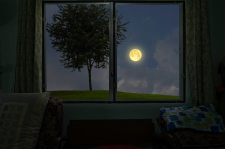 Moonlight drop through the window to the bedroomの写真素材