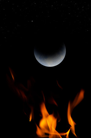 Romantic moon and stars over red flame in lonely nightの写真素材