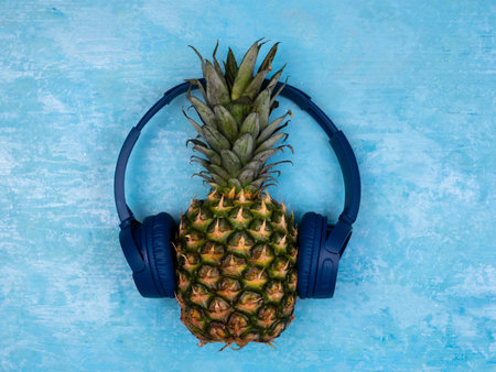 Funny pineapple with headphonesの写真素材