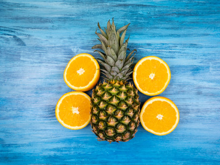 Pineapple with orange halvesの写真素材