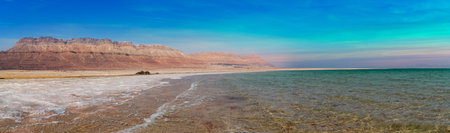 Amazing panoramic Dead Sea with blue and teal colors in the middle of the day. The most beautiful outdoor resortの写真素材