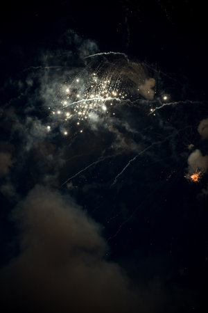 White Firework exploding in the sky for anniversary. Light show in the sky