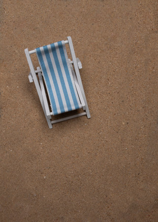 Sunbed laying on very fine sand in portrait flat layの写真素材