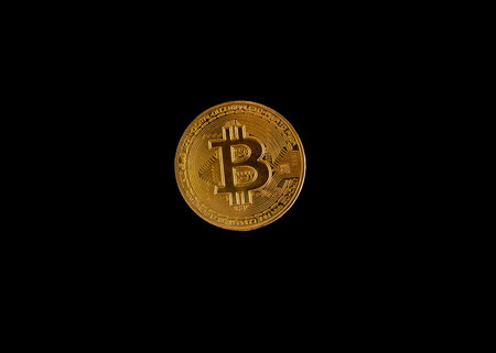 Bitcoin crypto coin captured against back backgroundの写真素材