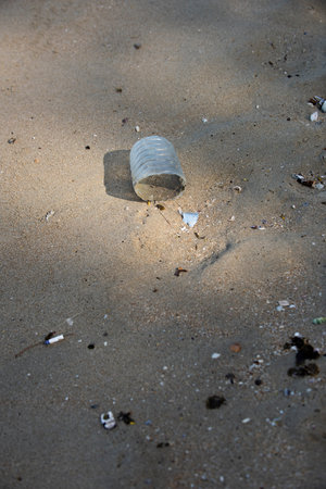 Plastic bottle found half left on the beach in the morning. A starting point of the environment...