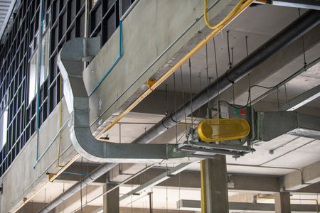 The BBQ restaurant ventilation system with airflow fan, air duct and pipe for ventilate vacuum odor and smoke from the kitchen and BBQ tables to outdoor area.の写真素材