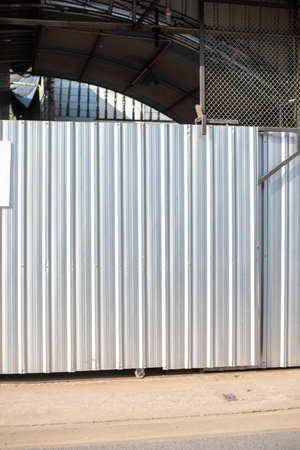 Aluminum Metal corrugated door sheet with black steel column structure.の写真素材