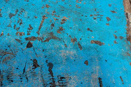 Fresh closeup turquoise color street texture, cropped only details showing rough painted and accidental patterns created by car wheels and weathers.の写真素材