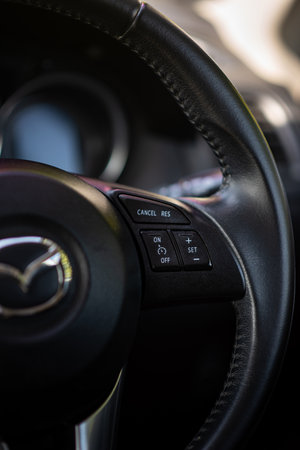 BANGKOK - Dec 4, 2021 : Close-up view of a cruise control on the steering wheel for a Mazda CX-5, Skyactiv technology, 2000cc. Showing buttons for an easy control on the right hand side.のeditorial素材