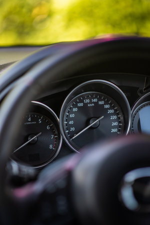 BANGKOK - Dec 4, 2021 : Mazda CX-5, Skyactiv technology, 2000cc., close-up of a dashboard focusing on a gauge trip meter, fuel gauge, water temperature, gear indicator and speedometer in black design.のeditorial素材