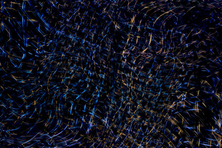Wave of light beams on stage with blue scheme from a music festival. Rays of searchlights looks very...