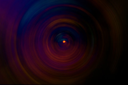 Abstract blurred background. Multi-colored circles on a black background.