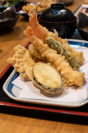 Crispy tempura Japanese food on a table in a Japanese restaurant.の写真素材