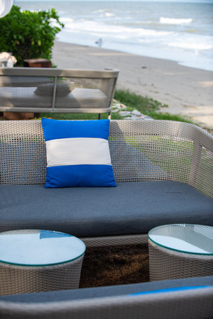 Outdoor patio with chair and pillow on the beach, Thailand.