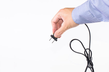 The man's hand handle with plugの写真素材