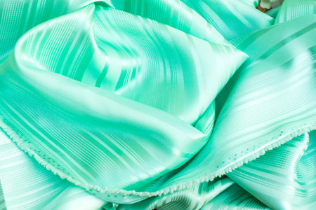 The smooth green silk, green clothing backgroundの写真素材