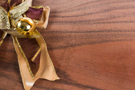 The big ribbon on the wood backgroundの写真素材