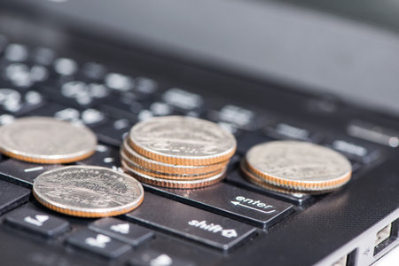 The group of coins on laptop, business conceptの写真素材