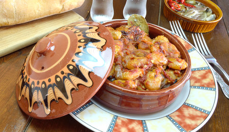 Greek meal with baked giant beans ,salteed fishes and breadの写真素材