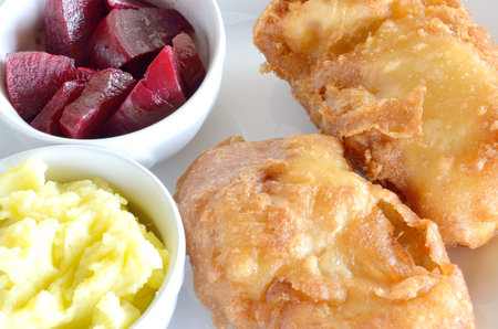Traditional Greek dish of fried cod fish fillet, garlic dip, known as skordalia and roasted beet saladの写真素材