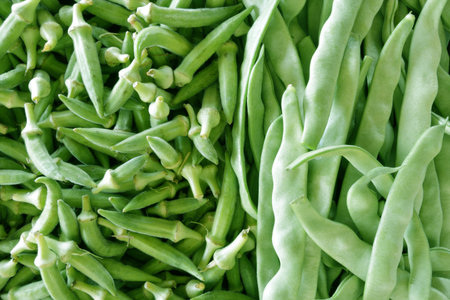 Fresh green okra and beans as background
