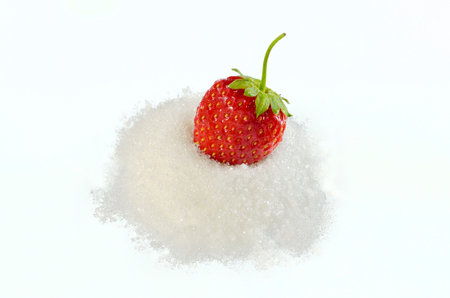 Strawberry in  sugar isolated on white backgroundの写真素材