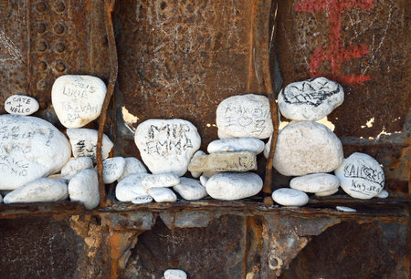 White rocks with written messages inside the shipwick in Navagio beach at island Zakynthos, Greeceの写真素材