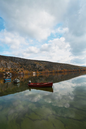 Boats in the calm water of the lakeの写真素材