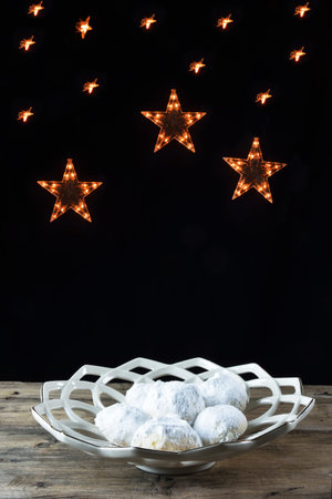 Kourabiedes in plate and lighting starsの写真素材