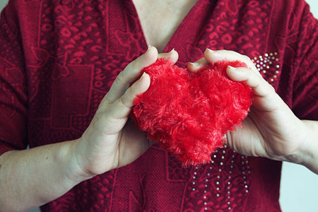  Hand carry red heart.の写真素材