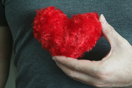  Hand carry red heart.の写真素材