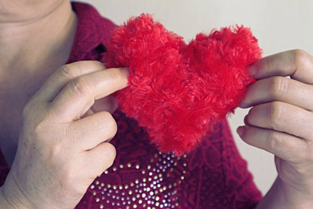 Hand carry red heart.の写真素材