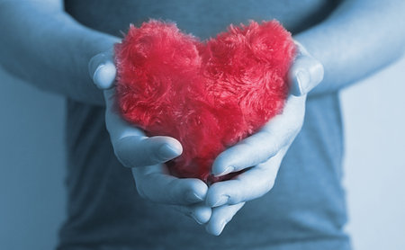  Hand carry red heart.の写真素材