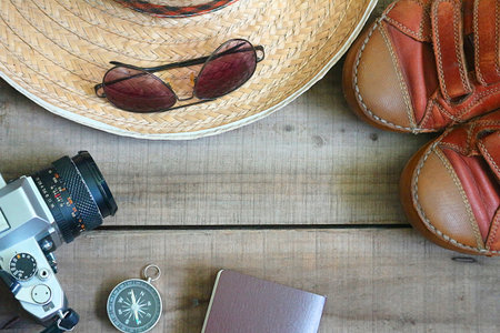 Topview travel 's accessories on wood plate, travel concept.の写真素材