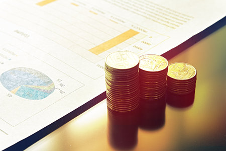 Stack of money and paper document on the table have sunlight from background.の写真素材