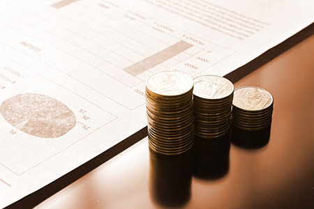 Orange theme stack of money and paper document on the glass table の写真素材