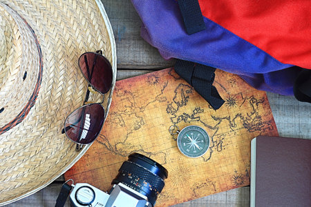 Topview travel 's accessories on wood plate , travel concept.の写真素材