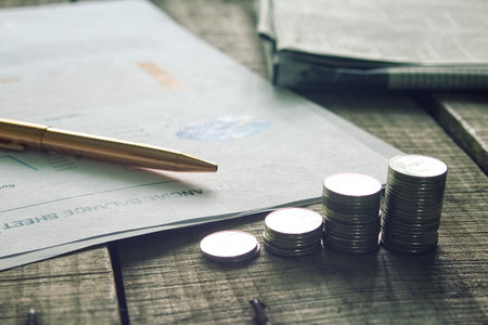 Stack of money on working desk, business concept.の写真素材