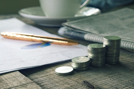 Stack of money on working desk, business concept.の写真素材