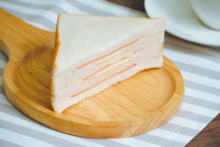 Sandwich on wood plate.の写真素材