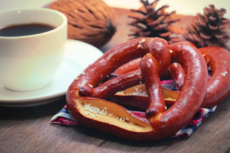 Pretzel with coffee on wood table