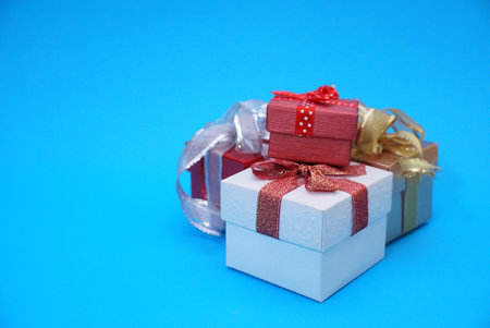 Group of christmas gifts on blue background.